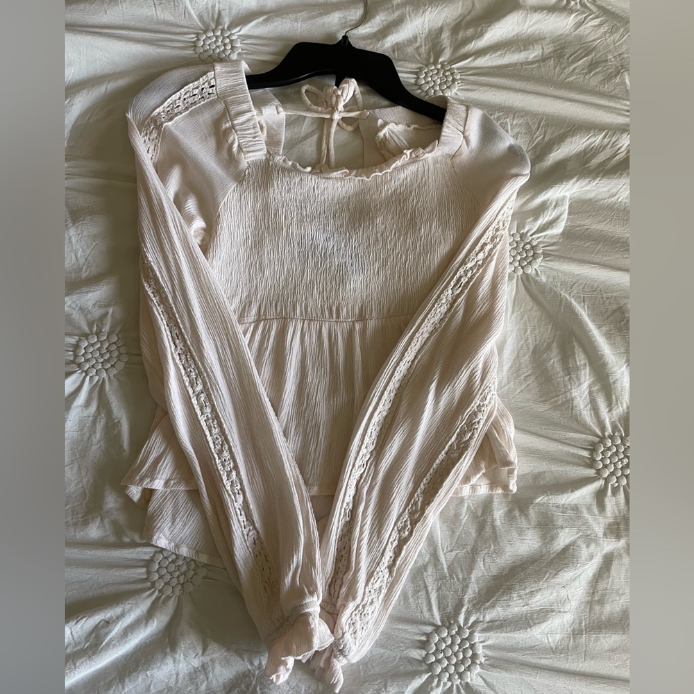 Cream long sleeve top with bow on back like new worn once